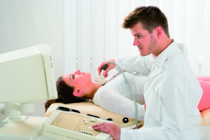 Young Woman Doing Neck Ultrasound Examination