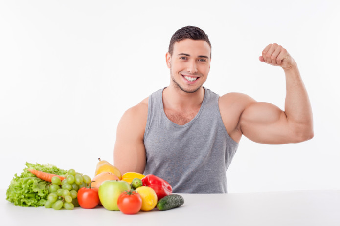 Attractive young fit man prefers healthy food